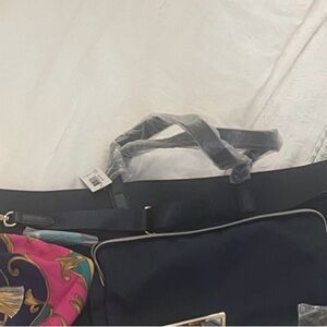 Estee Lauder Navy blue bag and Pink Cosmetic Bag Set.
Brand new never used.